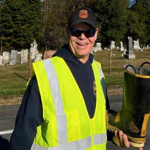 Freedom firefighters greet the motorists with the boot, a tradition of raising funds for the fire department. (Photo by Lynda Clancy)