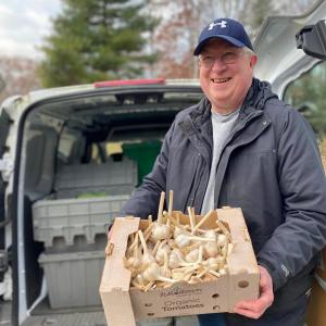 Carl Gluek picks up some garlic for the Boothbay Region Food Pantry. Courtesy photo
