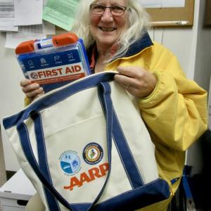 Woolwich select board member and State Rep Allison Hepler shows one of the "Care Bags" provided by Age-Friendly Communities of the Lower Kennebec. PHIL DI VECE/Wiscasset Newspaper
