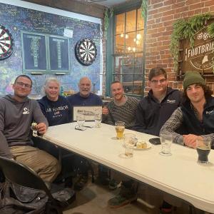 Trivia winners: The winning team poses with their victory plaque after the Ocean on Tap second anniversary trivia night at Footbridge Brewery on Feb. 19. Courtesy of Bigelow Laboratory