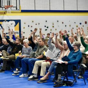 An article to replace funding for Patten Free Library in Bath with a plan to buy library cards for residents who can’t afford one was eventually passed by a show of hands after the town had run out of paper ballots. PHIL DI VECE/Wiscasset Newspaper
