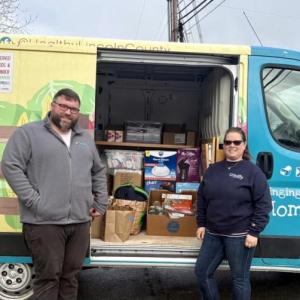 HLC’s Will Matteson and Samantha Mehlhorn stand with LuLu packed and ready to go out on a day of deliveries. Courtesy photo  