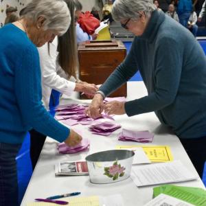 Ballot clerks count ballots at the annual town meeting on a motion concerning library funding.  PHIL DI VECE/Wiscasset Newspaper