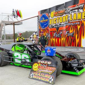 Ryan Neal climbs out of his car after earning his first career feature victory at Wiscasset Speedway. Jasen Dickey photo
