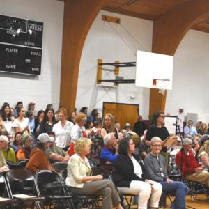 A line of community members of all ages wait to share personal stories and opinions during a forum to discuss MaineHealth Lincoln Hospital’s labor and birth unit at Great Salt Bay Community School in Damariscotta on Tuesday, June 2. Hospital officials expect to make a decision about the future of the unit in by August. (Emily Bracher photo)