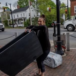 Brandi Marshall helps install planters downtown. BOB BOND/40 Federal Studio 