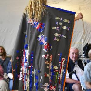 Both Nein's dress and detachable cape are decked out with scenes of ocean life. ISABELLE CURTIS/Boothbay Register