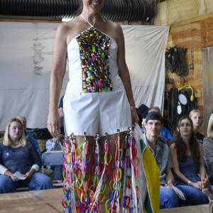 Who needs sequins when you have fishing lures? July Hasch secures three wins with her refashioned white coveralls. ISABELLE CURTIS/Boothbay Register