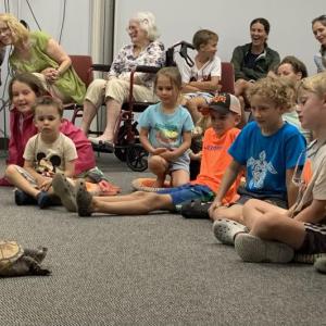 Don't worry, he doesn't bite! The excitement was palpable Aug. 7 as attendees got a tour of Mr. Drew's exotic animals from his organization in Poland, Maine. ISABELLE CURTIS/Boothbay Register