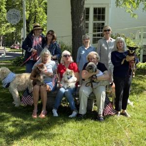 The Fundraising Committee of the Friends of the Wiscasset Public Library meet to plan Bands for Books.  First row from left: Cynthia Davis (with Quincy), Linda Adams (with Finnegan), Lynn Maloney (with Bradley), and Linda Smith (with Ginger). Second row from left:  Michelle Wentworth (with Sandy), Tracey Whitney, Stephanie Hergenroeder, and Laura Neebling (with Roland). Bill Maloney photo