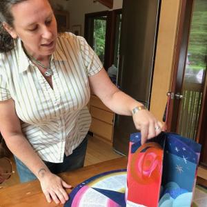 Book artist Joelle Webber displays one of her artist books. During Wiscasset Art Walk drop by her sidewalk paper flower workshop. Free materials provided. Photo courtesy of the artist