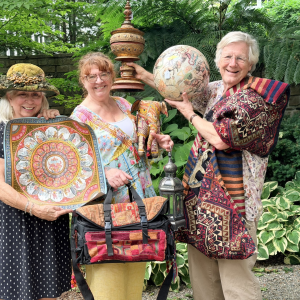From left to right Linda Marshall, Christine Buckley of Camden Curated and Christine's Framing Gallery, and Dr. Stephen Huyler, with some of the exotic treasures being readied for the epic estate sale hosted by Stephen and Helene on their property, Sept. 19 to benefit Finding Our Voices. Patrisha McLean photo