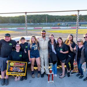 Kevin Sherman is joined by friends and family following his $6,000 Crown Vic win. Jasen Dickey photo