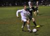Mason Whitaker, left, tries to get the ball past a Winthrop defender. Wiscasset would win its homecoming game, 4-1, behind a goal from Whitaker. BEN BULKELEY/Wiscasset Newspaper
