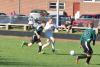 CAMDEN REISS, center, fights his way through Spruce Mountain’s defense in this October 8 file photo. Reiss and the Wolverines will look to continue their winning ways October 18 against Oak Hill. BEN BULKELEY/Wiscasset Newspaper
