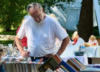 So many books, so little time at Summerfest, the annual; yard sale.