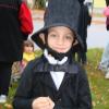 Honest-ly adorable as Abraham Lincoln at the Wiscasset Parks & Recreation Department's goblins parade October 31, Alna's Austin Trask, 7, on hand with mom Michelle Trask, prepares to depart Wiscasset Middle School. Dozens of costumed youth and their costumed or plain-clothed families then headed down Federal Street under fire trucks’ escort. SUSAN JOHNS/Wiscasset Newspaper