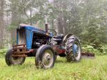Classic tractor now used for road grading